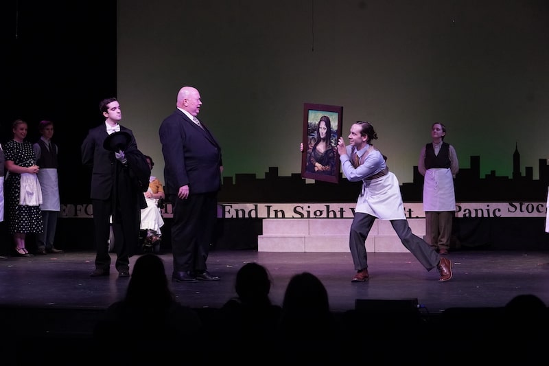 Daddy Warbucks is shown a piece of art