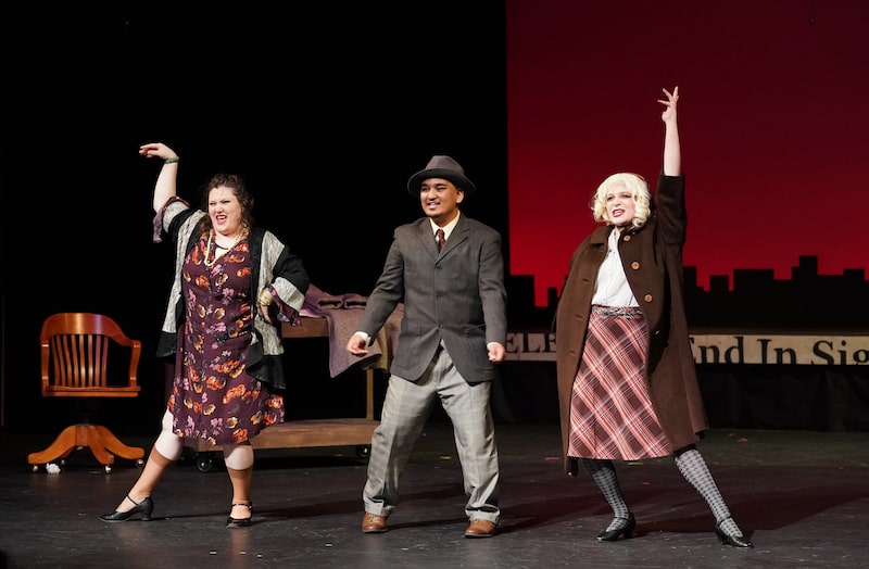 Miss Hannigan, Rooster, and Lily St. Regis dance together