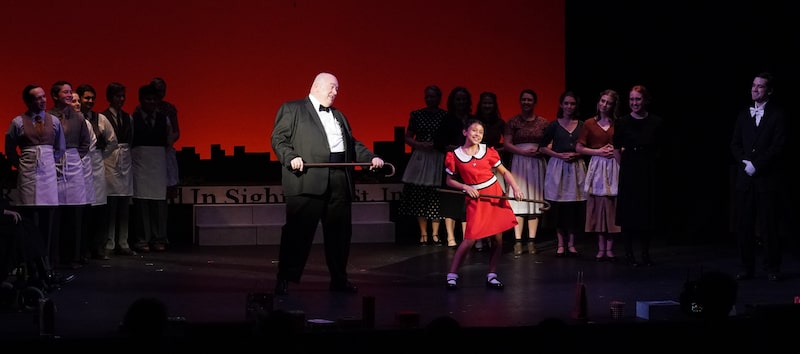 Annie and Daddy Warbucks dance together